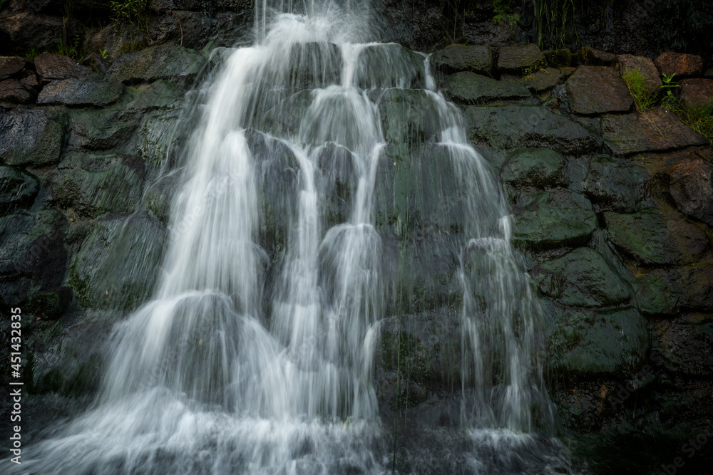 Naklejka premium Details of a beautiful waterfall in a countryside