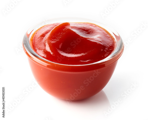 Bowl of ketchup or tomato sauce isolated on white