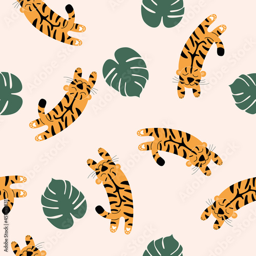 Vector seamless pattern with spotted tigers.  Tigers on a beige background are jumping into palm leaves.  Wildlife and fauna, Vector flat illustration.  A family of felines or carnivores.