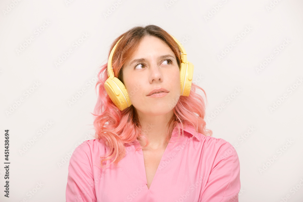 woman dressed in pink and yellow headphones woman dressed in pink and yellow headphones