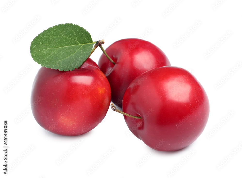 Delicious ripe cherry plums with leaf on white background Delicious ripe cherry plums with leaf on white background