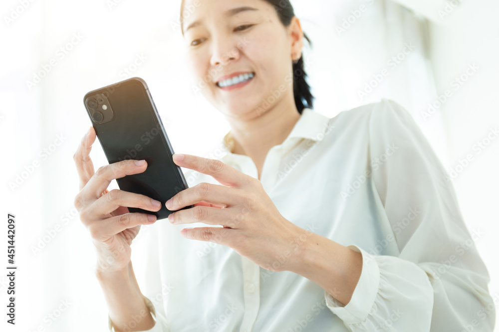 woman work using cell phone hand holding mobile texting message contact us.chatting,search internet information in office.technology device communication connecting woman work using cell phone hand holding mobile texting message contact us.chatting,search internet information in office.technology device communication connecting
