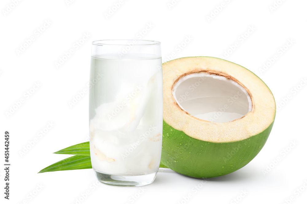 Glass of coconut juice with cut in half isolated on white background. Glass of coconut juice with cut in half isolated on white background.
