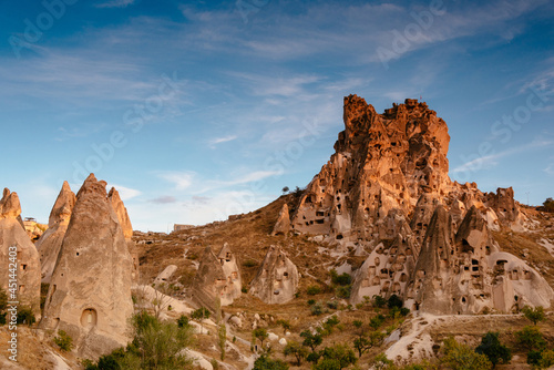 Amazing view of Uchisar Castle at suset. The high castle mountain, which is visible over a wide distance. Goreme National Park. Cappadocia.Turkey. Traveling concept background.
