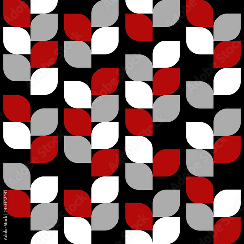 Retro style seamless pattern with abstract colorful (red, white, black) leaves decoration on black background