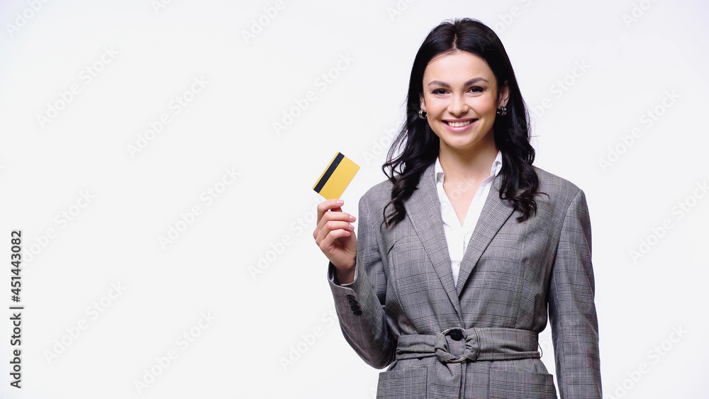 Young manager in jacket holding credit card isolated on white. Young manager in jacket holding credit card isolated on white.
