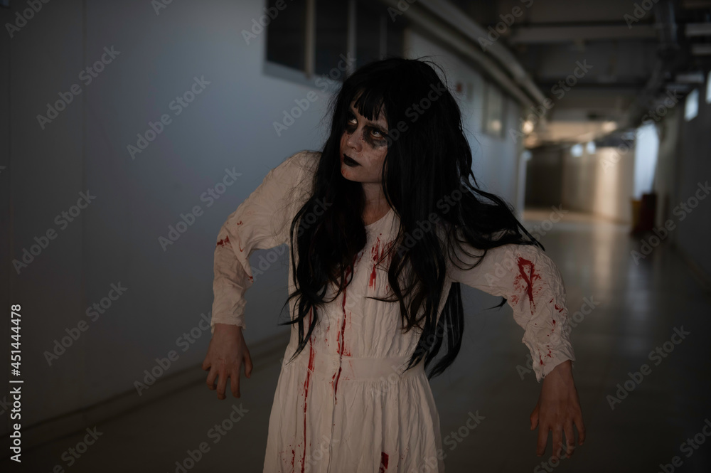 Obraz premium Portrait of asian woman make up ghost,Scary horror scene for background,Halloween festival concept,Ghost movies poster