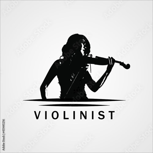 Beautiful violinist girl playing the violin