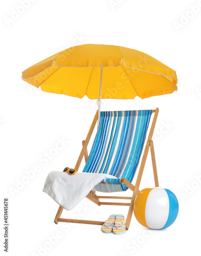 Vászonkép Open yellow beach umbrella, deck chair, inflatable ball and accessories on white
