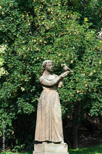 Statue of young woman in park of Prague