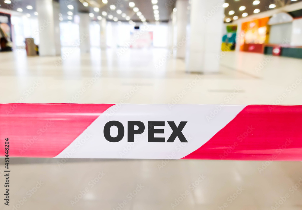 OPEX business text on red ribbon with restrictions.