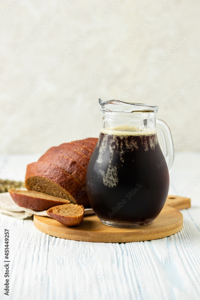 Rye kvass in a jar on wooden background. Space for text. Rye kvass in a jar on wooden background. Space for text.