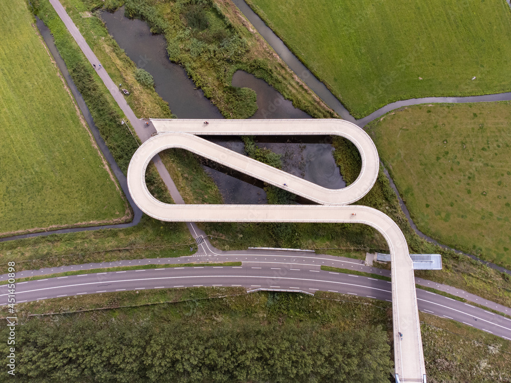 Pedestrian and cyclist bridge over the Amsterdams Rijn Canal, waterway in Nigtevecht The Netherlands. Liniebrug Pedestrian and cyclist bridge over the Amsterdams Rijn Canal, waterway in Nigtevecht The Netherlands. Liniebrug