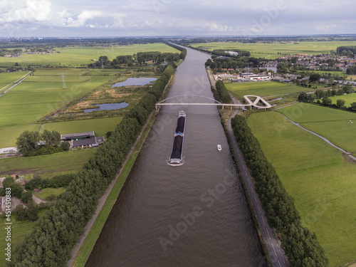 Pedestrian and cyclist bridge over the Amsterdams Rijn Canal,  waterway in Nigtevecht The Netherlands. Liniebrug