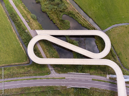 Pedestrian and cyclist bridge over the Amsterdams Rijn Canal,  waterway in Nigtevecht The Netherlands. Liniebrug photo