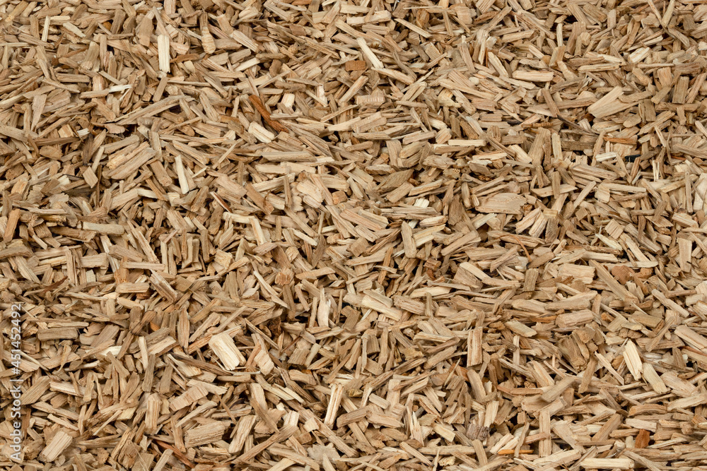 Oak chips sawdust texture. small wood chips for smoking. sawdust background. ecological fuel