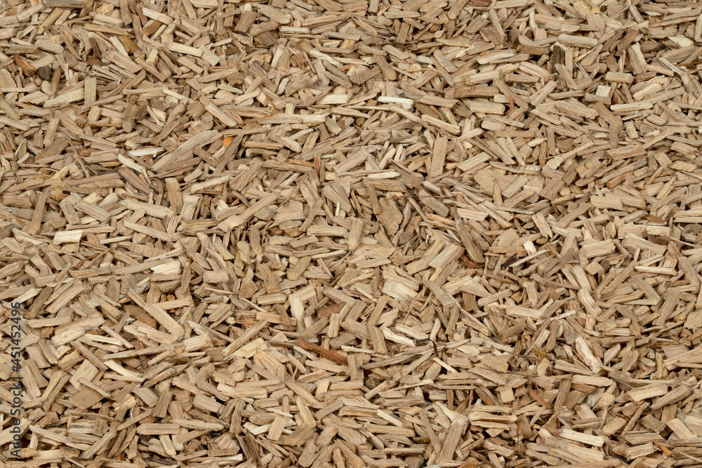 Oak chips sawdust texture. small wood chips for smoking. sawdust background. ecological fuel Oak chips sawdust texture. small wood chips for smoking. sawdust background. ecological fuel