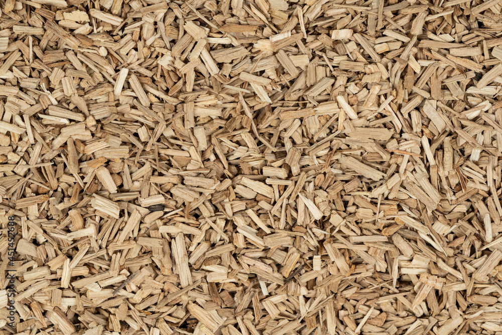 Oak chips sawdust texture. small wood chips for smoking. sawdust background. ecological fuel Oak chips sawdust texture. small wood chips for smoking. sawdust background. ecological fuel