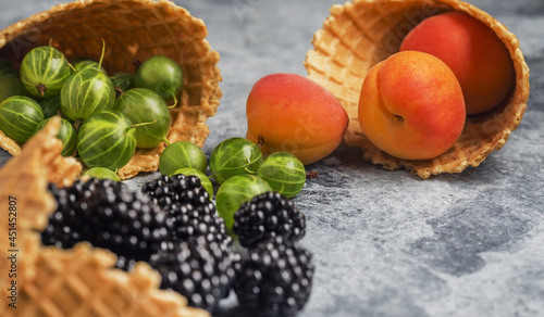 background of berries and waffle cups on the table