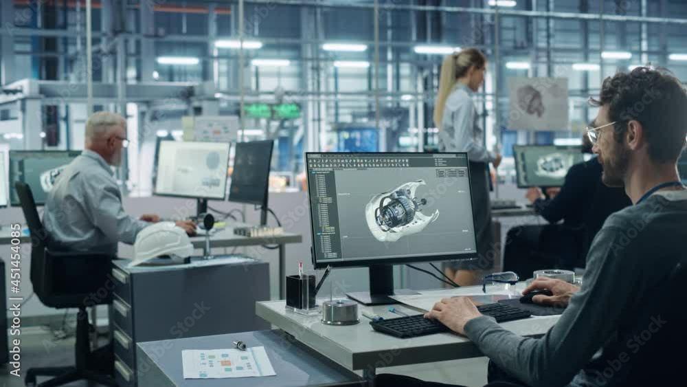 Car Factory Office: Engineer Working on Turbine Prototype on Computer, Design Advanced 3D Model for High-Tech Green Energy Electric Engine. Diverse Team Work in Automated Manufacturing Facility