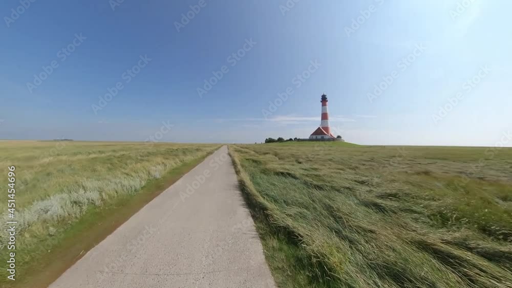 Nordseeküste - Leuchturm Westerhever bei Sonnenuntergang Nordseeküste - Leuchturm Westerhever bei Sonnenuntergang