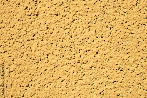 Rough yellow cementitious surface. Texture surface background