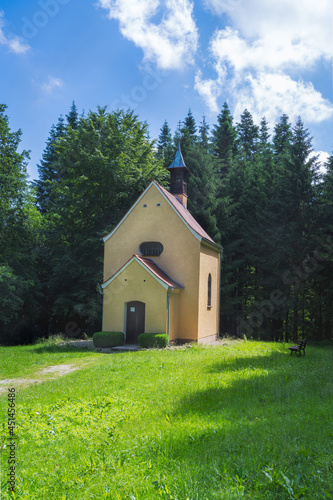 Chapel in a forest clearing