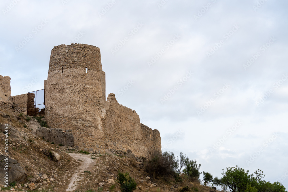Ruins of Bairén's castle in Gandia (Valencia, Spain), in an afternoon with cloudy skies.