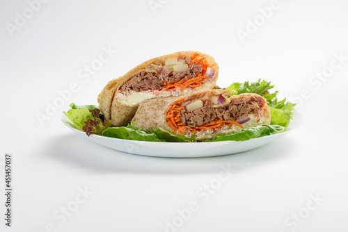 Front view of delicious tuna, carrot and cheese wrap, isolated photo