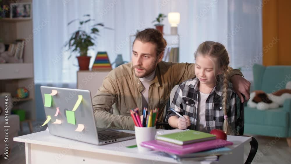 father helping daughter with homework during online lessons, man and girl having fun and giving each other five happy school tests father helping daughter with homework during online lessons, man and girl having fun and giving each other five happy school tests