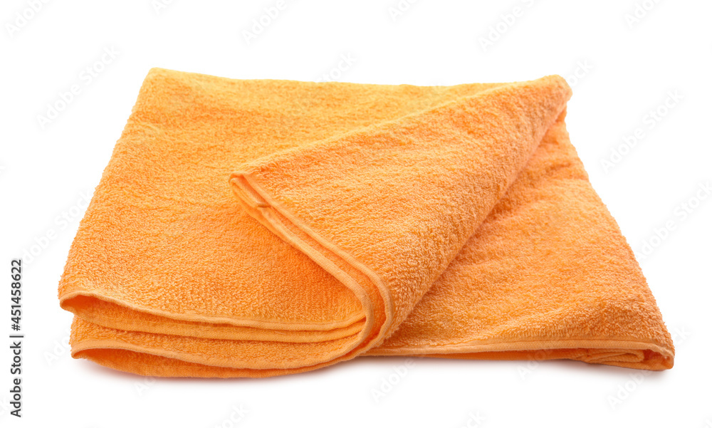 Folded orange beach towel isolated on white Folded orange beach towel isolated on white