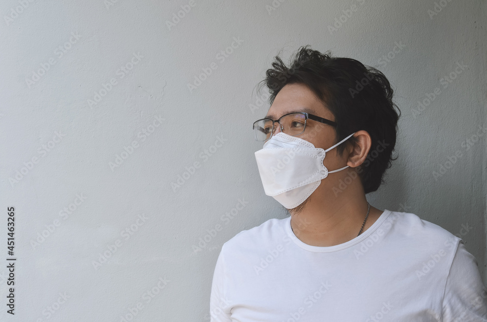 Asian men wearing mask for protect coronavirus, PM2.5 dust and air pollution concept. Asian men wearing mask for protect coronavirus, PM2.5 dust and air pollution concept.
