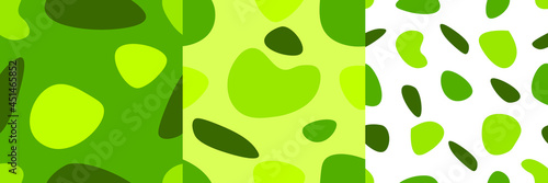 A set of three isolated abstract patterns with random spots in a green color scheme. Vector illustration in modern style. Stamp texture, wallpaper collection. minimalist art. photo