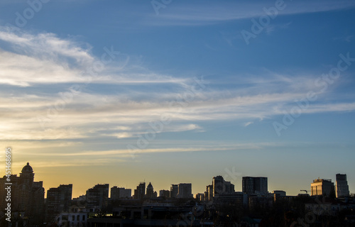 Panorama view of Kyiv cityscape with silhouette of buildings against sunset sky  Ukraine