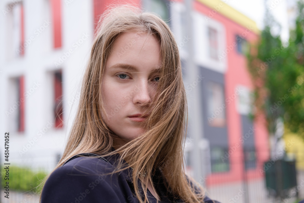 pretty brunette woman on background of bright modern buildings. feminine. millennial people. lady on walk pretty brunette woman on background of bright modern buildings. feminine. millennial people. lady on walk