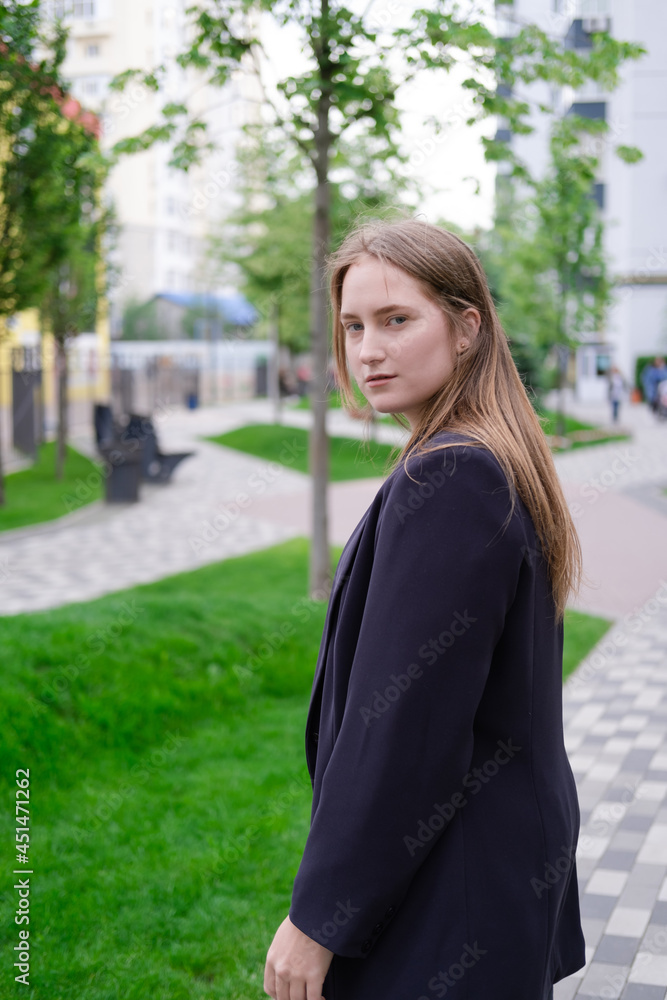 pretty brunette woman on background of bright modern buildings. feminine. millennial people. lady on walk pretty brunette woman on background of bright modern buildings. feminine. millennial people. lady on walk