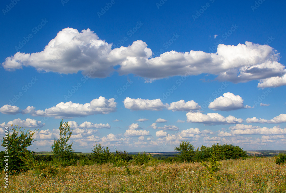 White clouds in the blue sky.