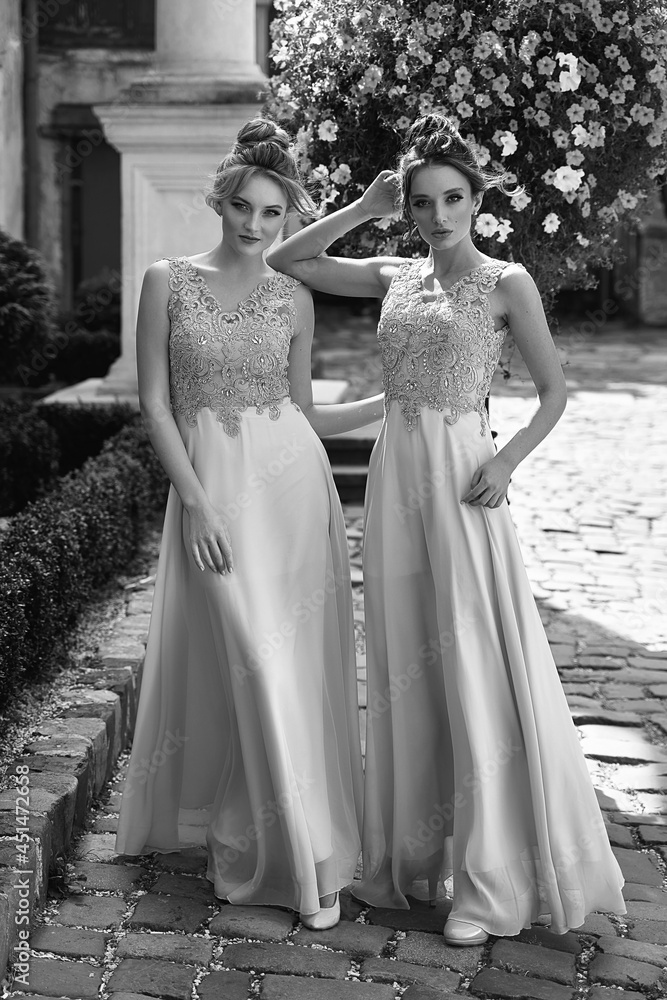 European girls bridesmaids in pink dresses having fun