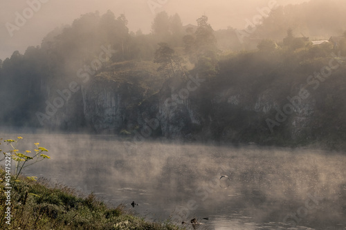 Misty August morning in the Urals in Mezhevoy village.