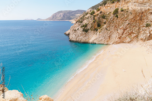 Picturesque sea bay with beautiful beach with turquoise water. Summer beach holiday background