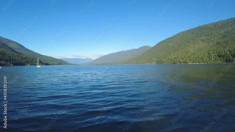 Beautiful Kootenay Lake in British Columbia, Canada. Kootenay Lake is a long lake located in the Kootenay region of British Columbia. Beautiful Kootenay Lake in British Columbia, Canada. Kootenay Lake is a long lake located in the Kootenay region of British Columbia.