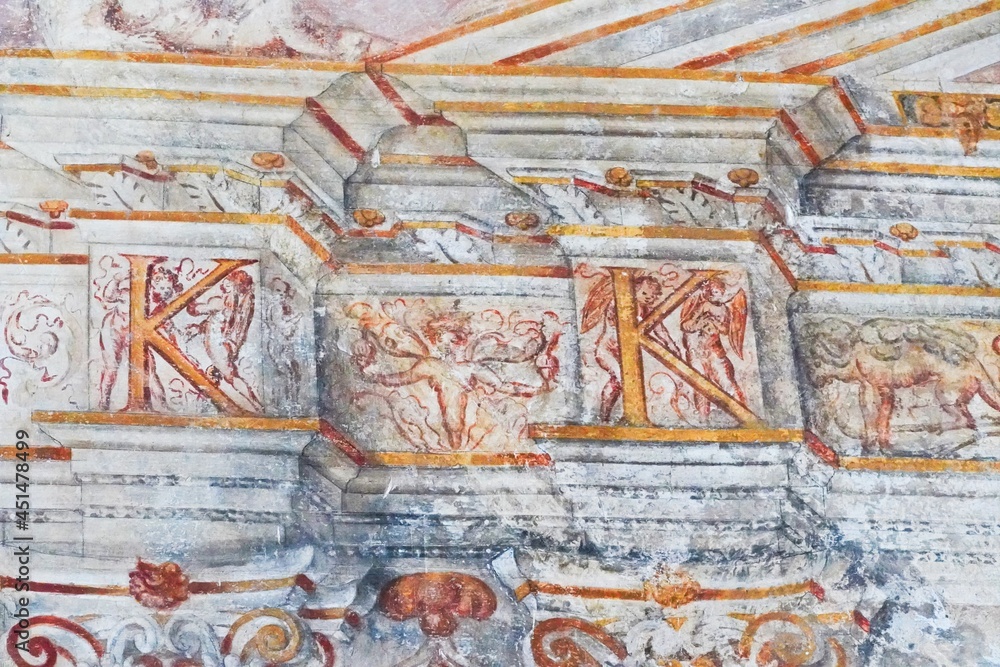 Ancient Italian fresco detail with K letter, angels with wings, column design, lines and animals.