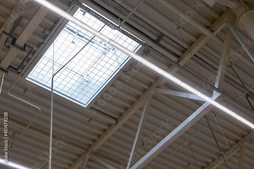 ventilation window with automatic opening in the roof of a shopping center or warehouse