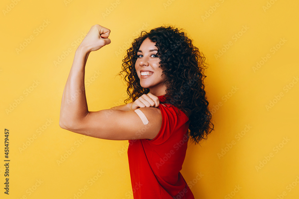 a black African American woman is vaccinated against covid and is very happy about it. the joy of having a vaccine made. - obrazy, fototapety, plakaty 