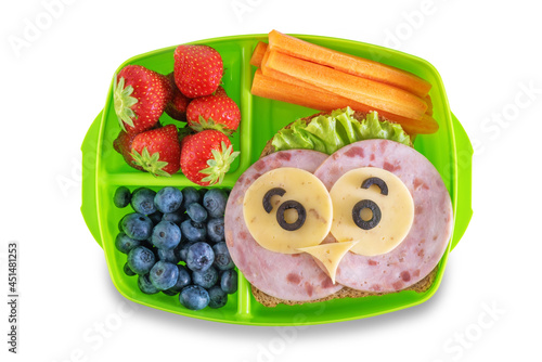 Kid's healthy breakfasts with funny faces in a container on a white isolated background