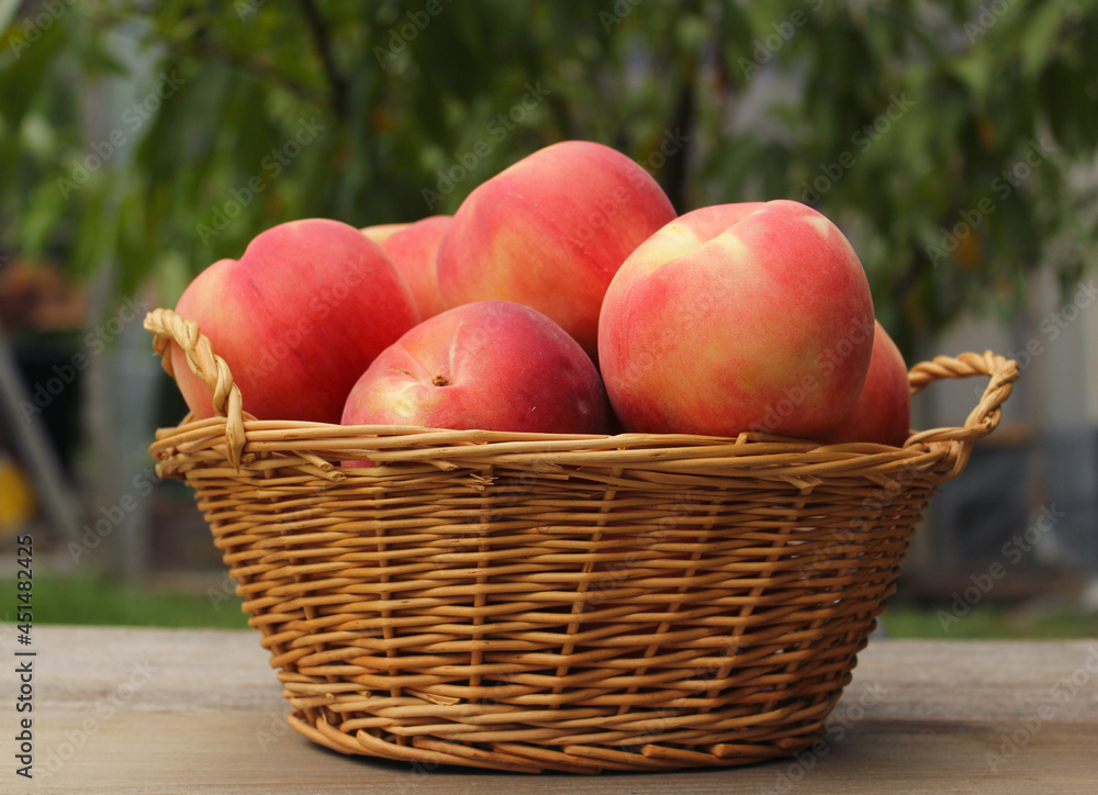Basket of Fresh Organic Peaches on table at Market Basket of Fresh Organic Peaches on table at Market