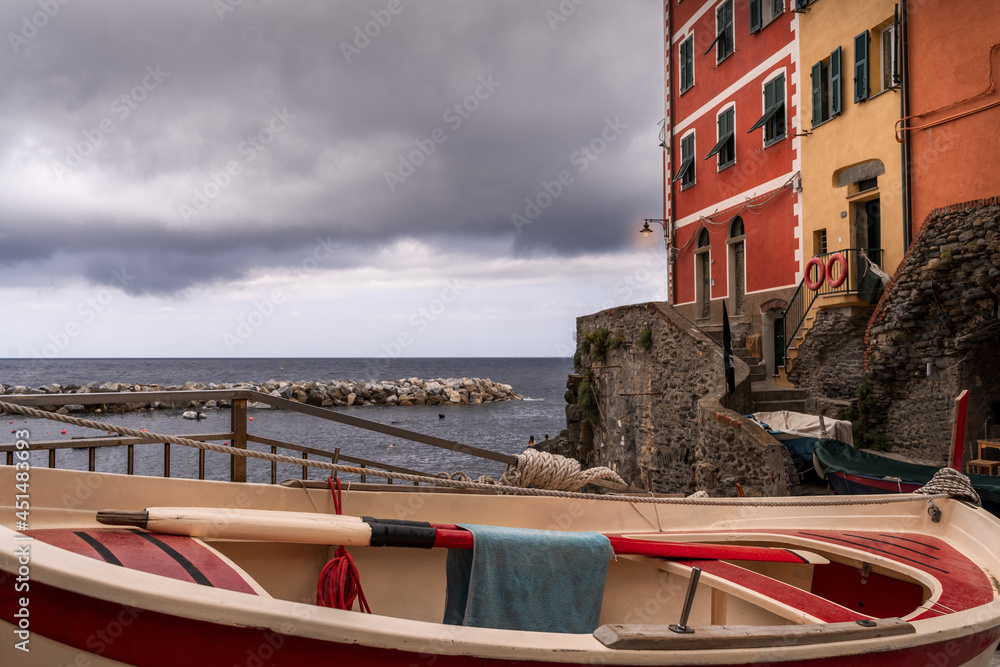 the small village of Riomaggiore Italy. Fishing boat in the foreground