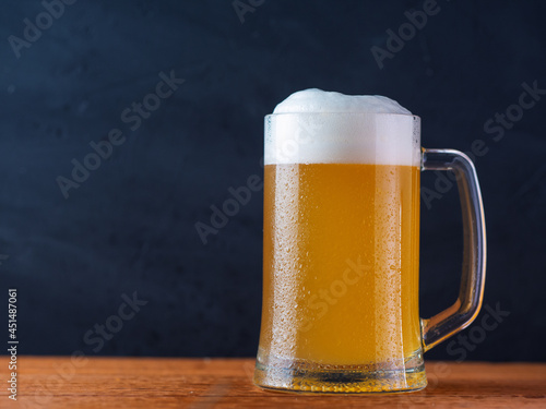 Wheat beer mug on a dark background with copy space