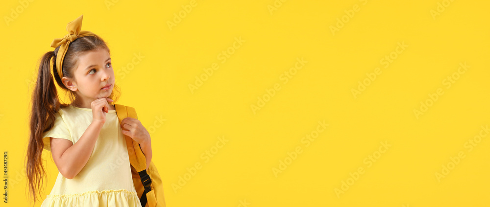 Cute little schoolgirl on color background with space for text Cute little schoolgirl on color background with space for text