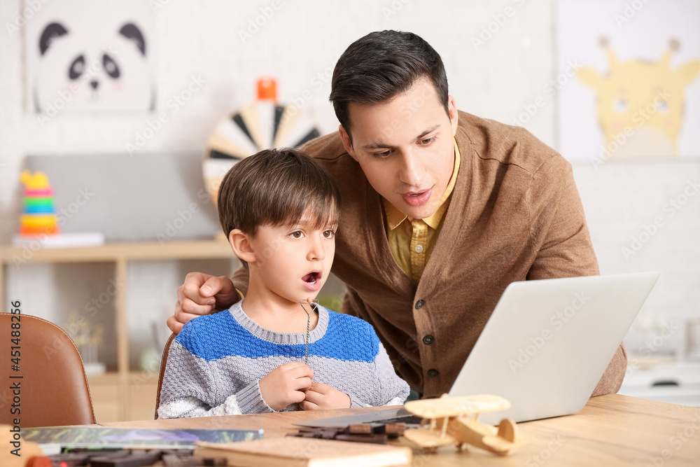 Speech therapist working with little boy in office Speech therapist working with little boy in office